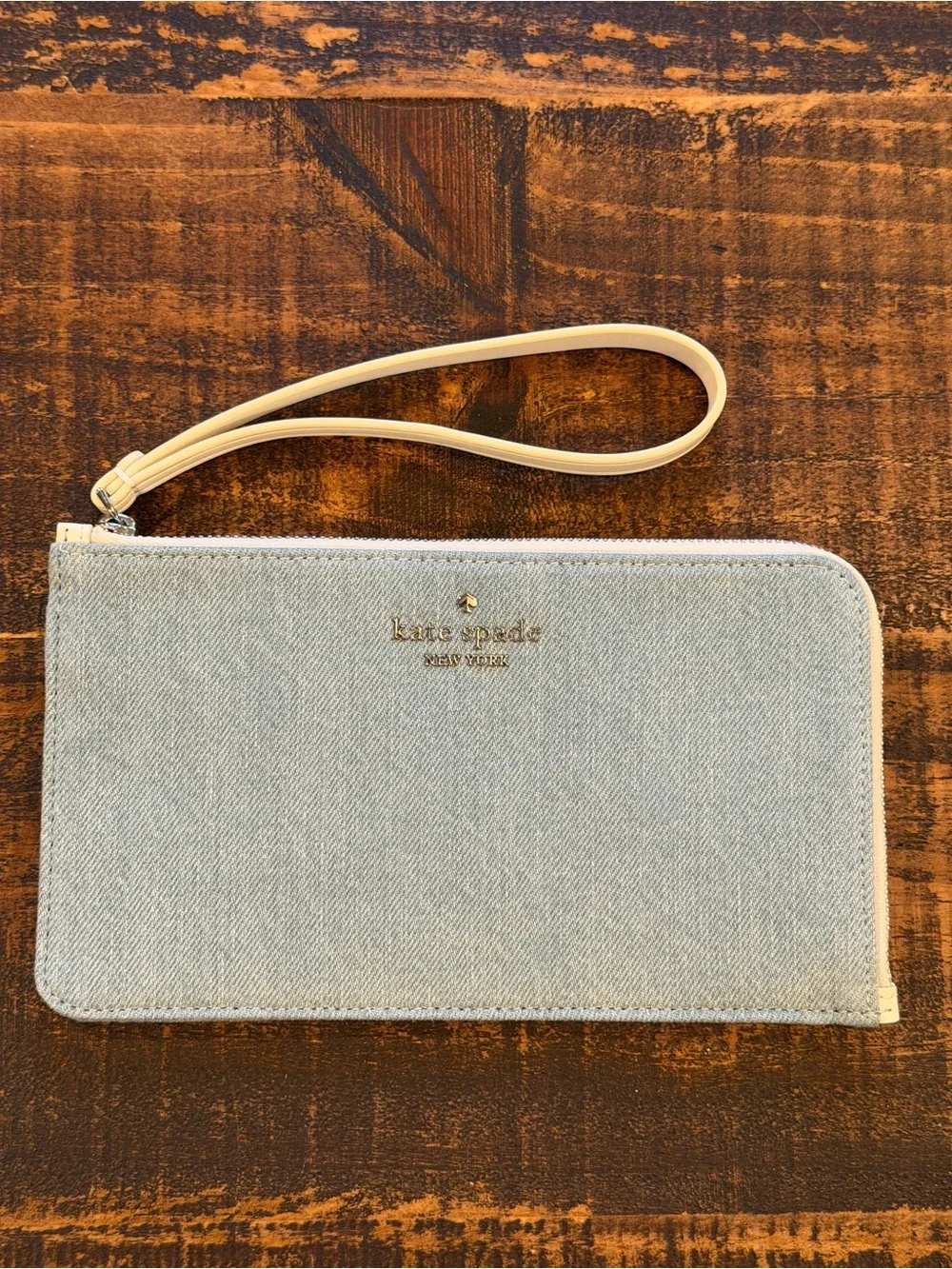 kate spade light denim wristlet with cream strap